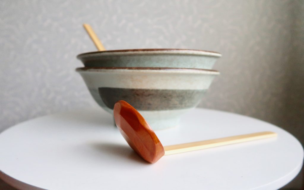 Image: Side view of the sakura ramen bowls and wooden ladles from Sous Chef