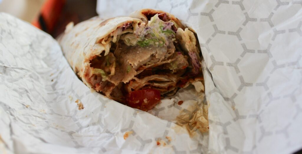 Close up of a wrap from German Doner Kebab