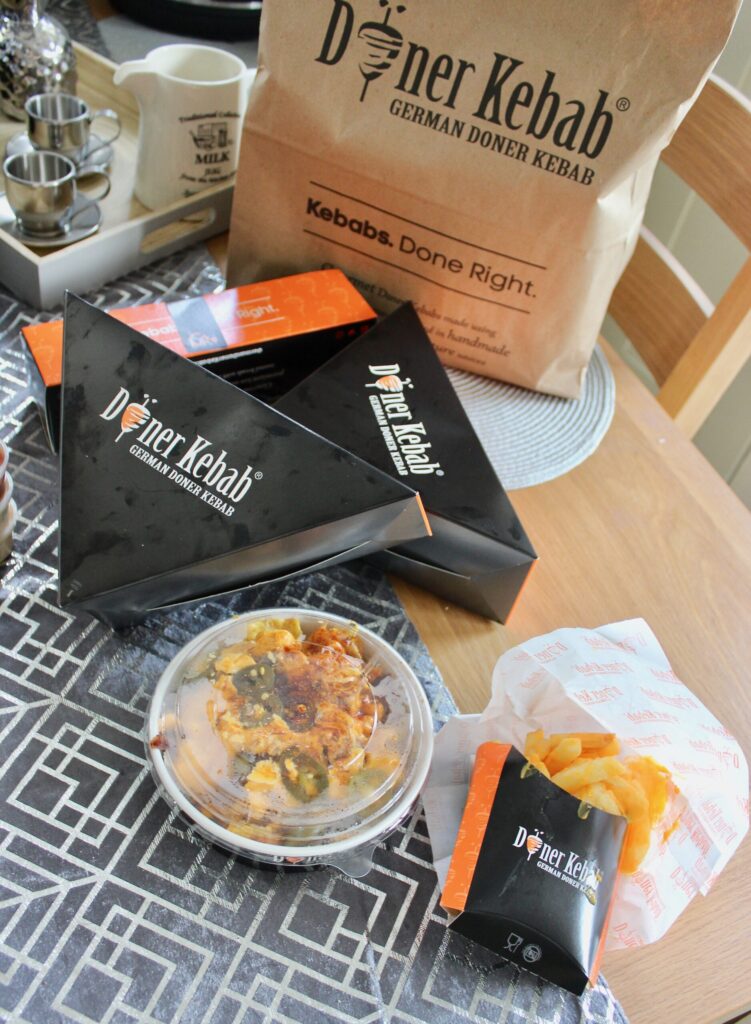 A table laid with a selection of food from German Doner Kebab