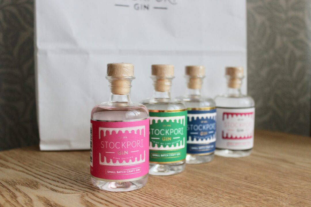 four miniature bottles of stockport gin in different flavours
